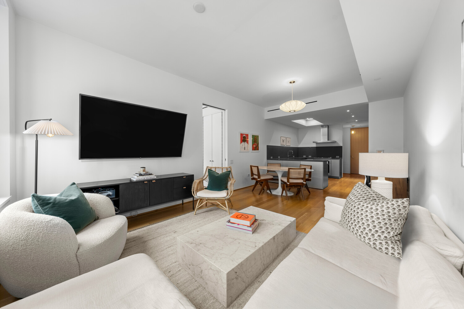 71 Reade Street, Unit 4C Manhattan, NY 10007 - Photo 6 of 12 a living room with furniture and a flat screen tv