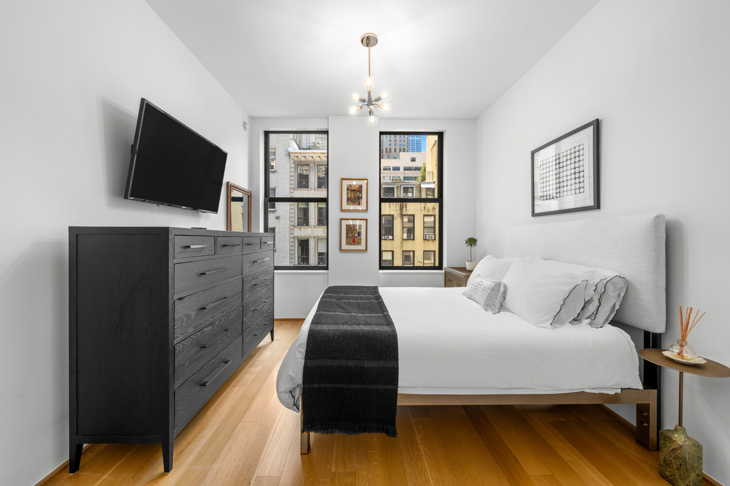 71 Reade Street, Unit 4C Manhattan, NY 10007 - Photo 7 of 12 a bedroom with a bed and a flat screen tv