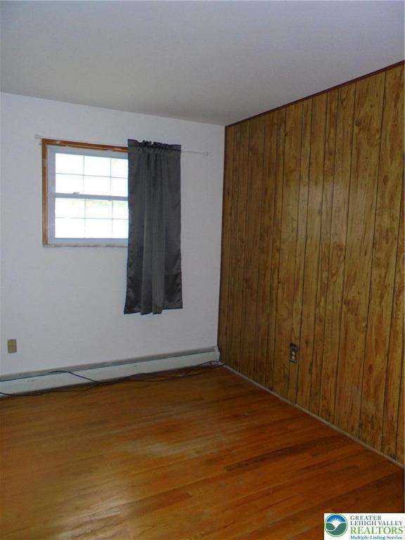 1217 Salisbury Road Allentown, PA 18103 - Photo 13 of 21 a view of an empty room with wooden floor and a window