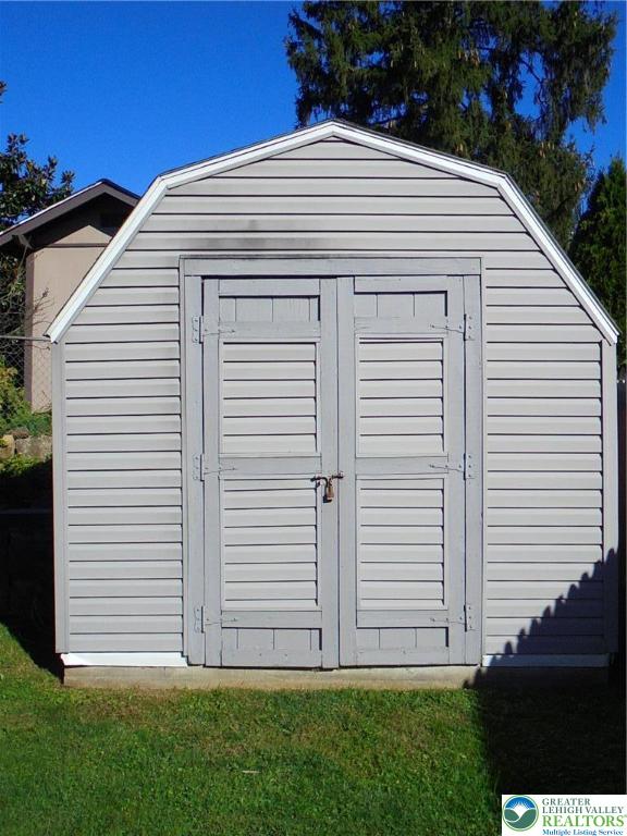 1217 Salisbury Road Allentown, PA 18103 - Photo 21 of 21 a view of a white house with a yard and potted plants
