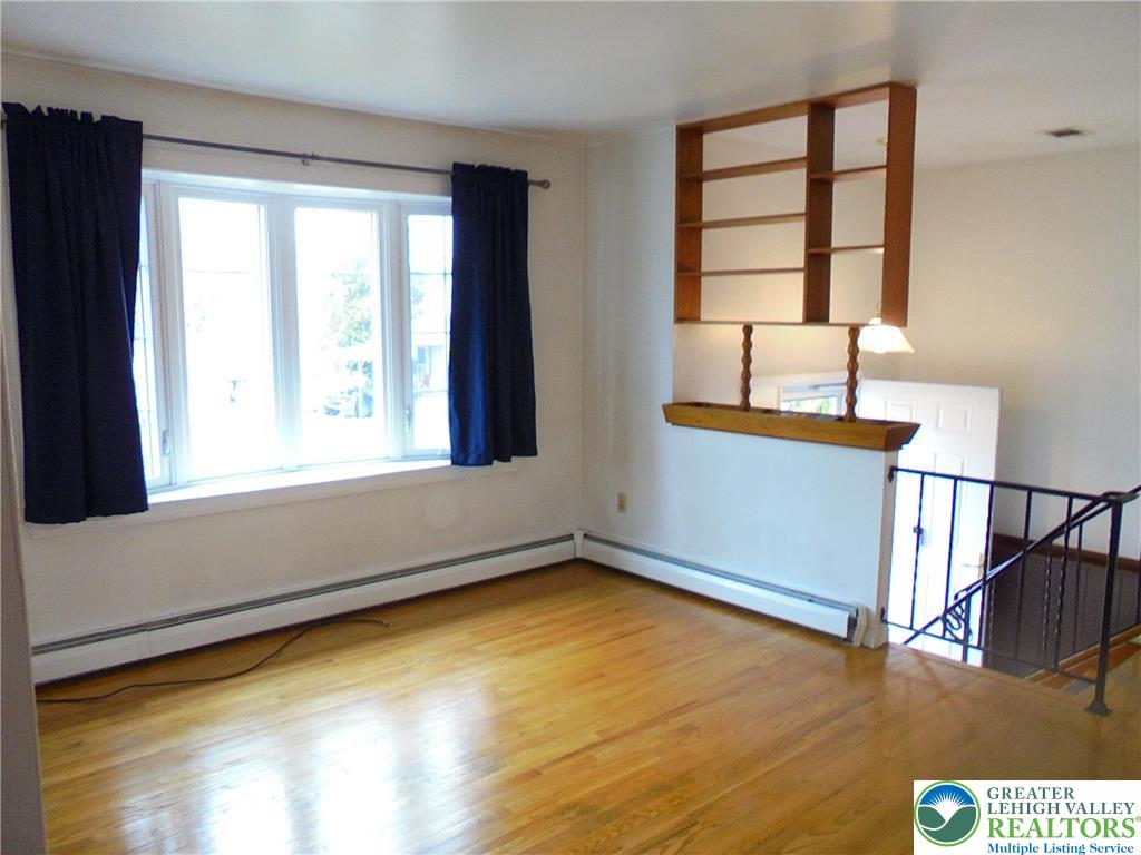 1217 Salisbury Road Allentown, PA 18103 - Photo 4 of 21 a view of empty room with wooden floor and fan