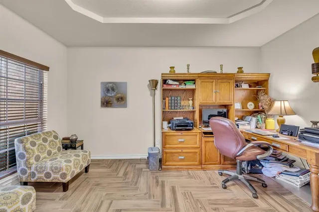 a work room with furniture and wooden floor