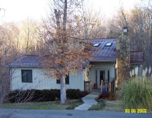 1165 Rudy Court Goodview, VA 24095 - Photo 1 of 1 a front view of a house with a yard and garage
