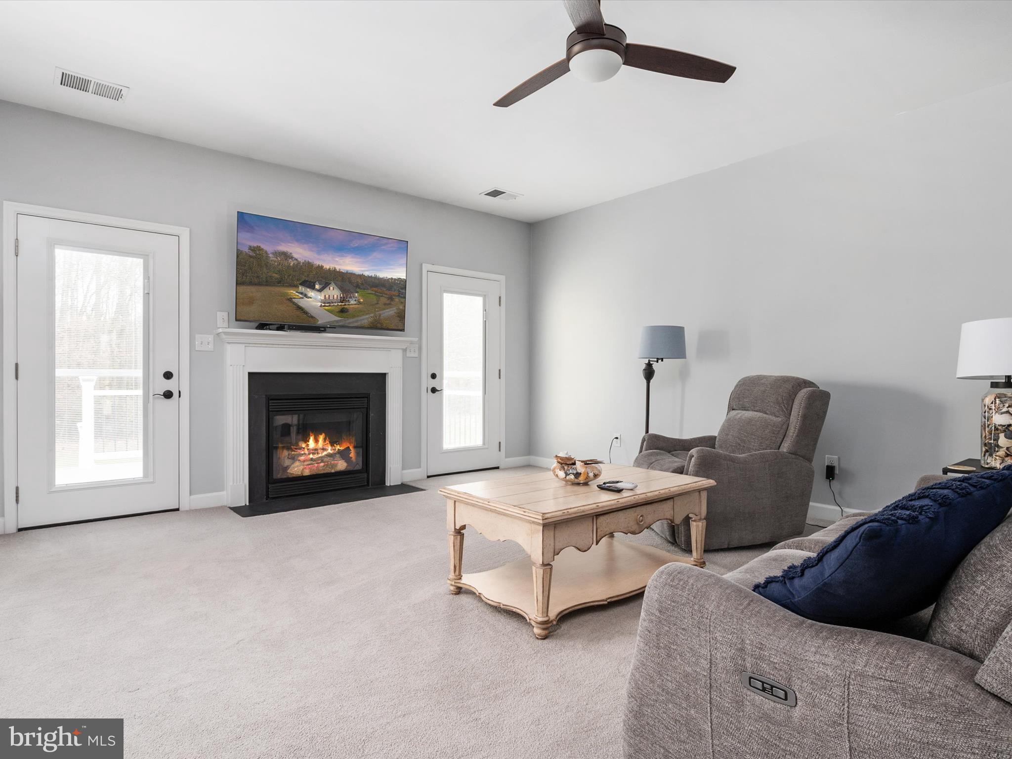 828 Duhamel Corner Road Marydel, MD 21649 - Photo 12 of 52 a living room with furniture and a fireplace