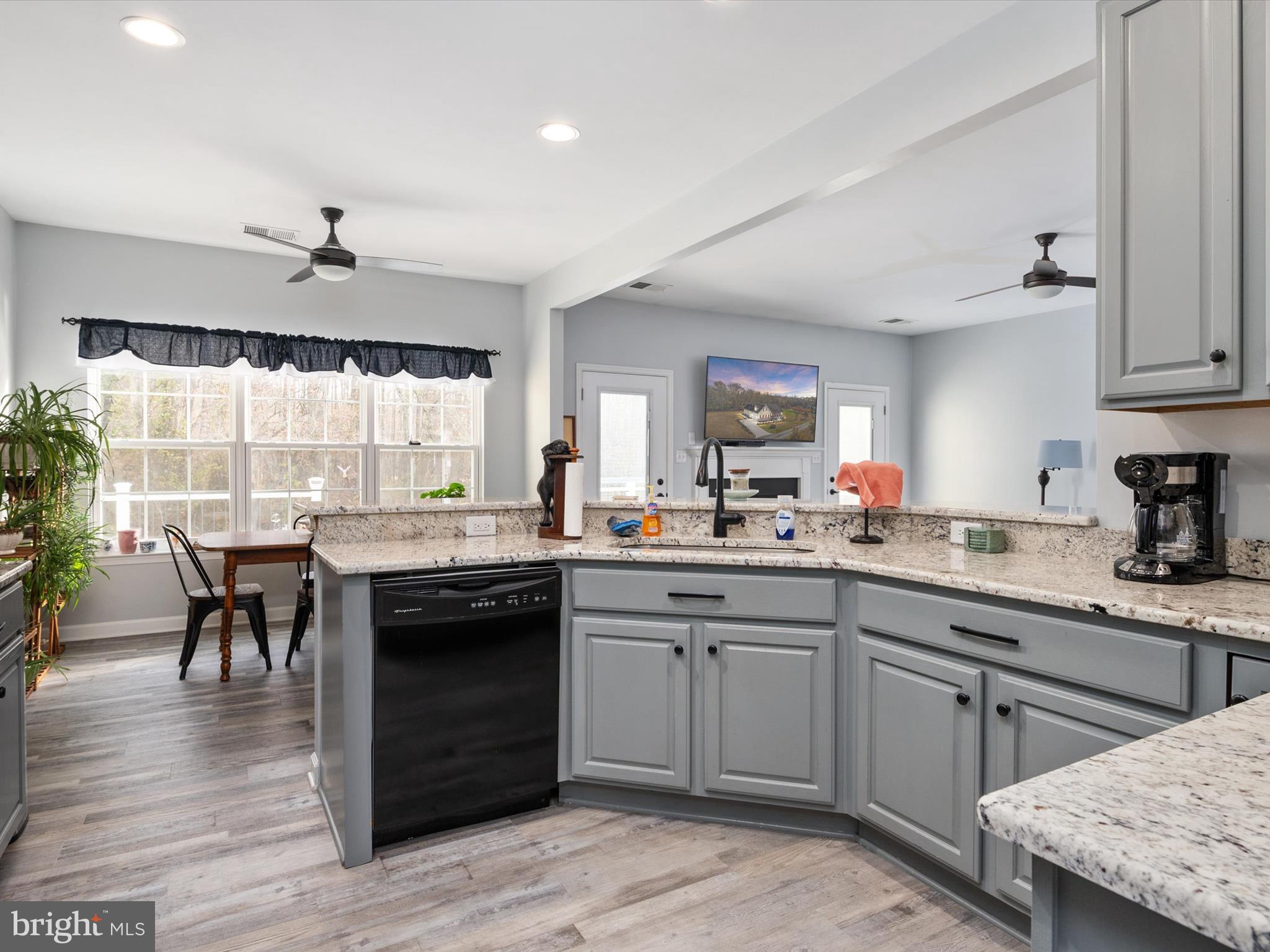 828 Duhamel Corner Road Marydel, MD 21649 - Photo 3 of 52 a kitchen with a sink and cabinets