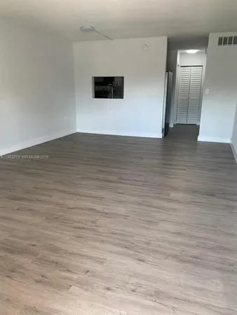 a view of a livingroom with wooden floor