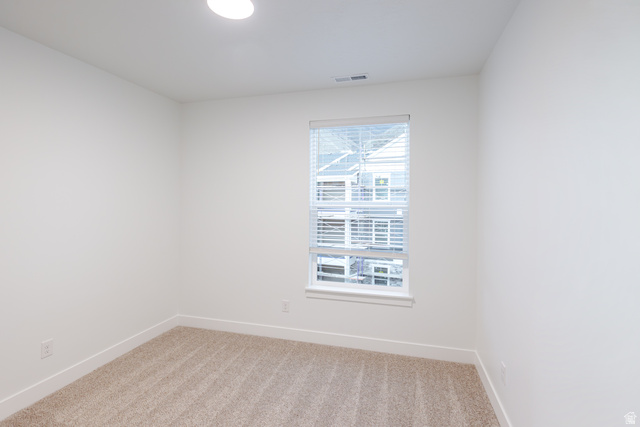 4661 Poplar Way, Unit R301 Mapleton, UT 84664 - Photo 5 of 17 Spare room featuring baseboards and light carpet
