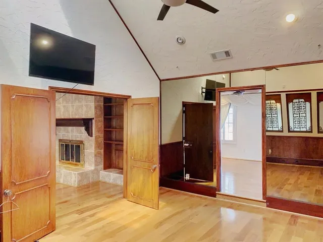 a view of a house with a flat screen tv