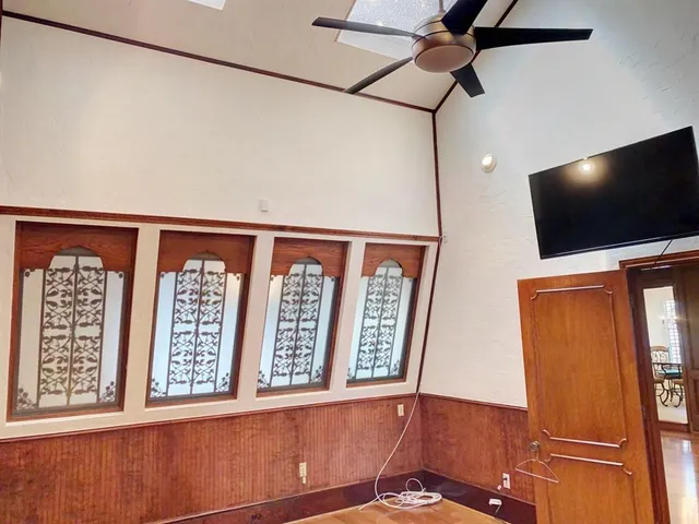 a view of a living room with furniture and a flat screen tv