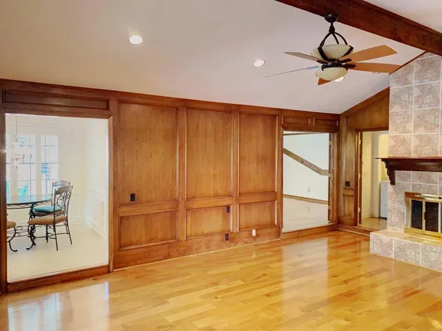 a view of a livingroom with furniture a ceiling fan and window