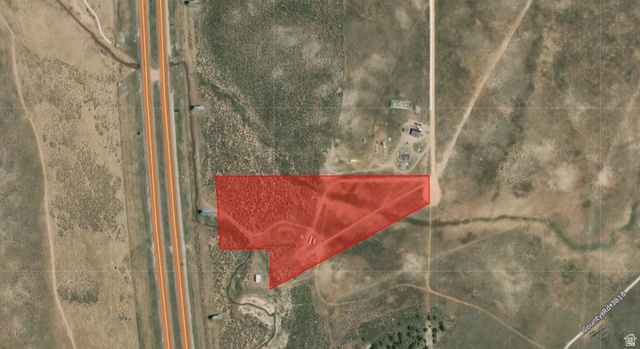 10398 West 17400 S Road Beaver, UT 84713 - Photo 11 of 11 Aerial Map. Displaying the property boundaries highlighted in red, situated alongside a major roadway and adjacent to other land parcels