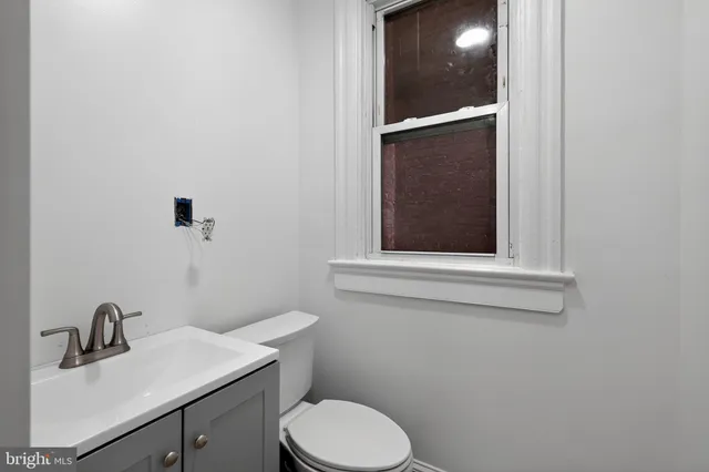 a bathroom with a toilet and a sink