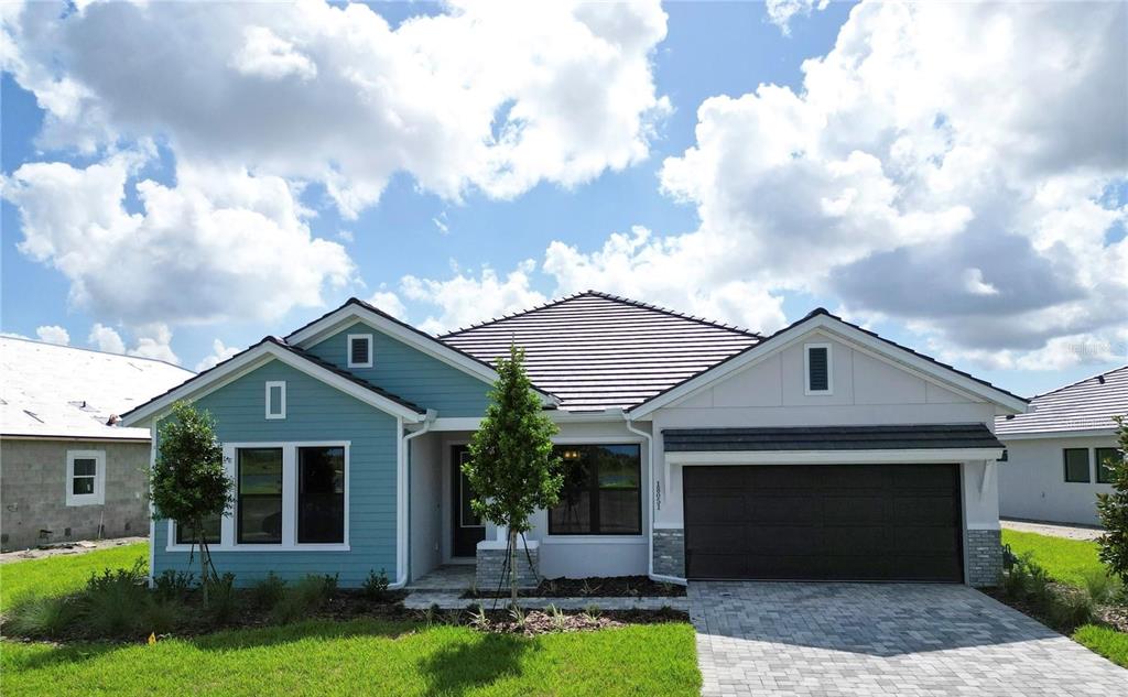 a front view of a house with garden