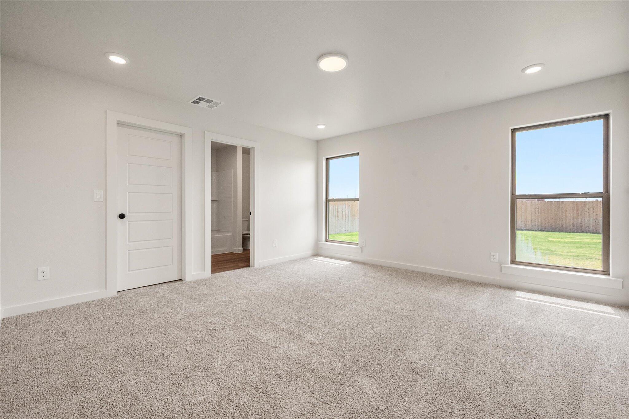 7215 8th Street Lubbock, TX 79416 - Photo 13 of 21 a view of an empty room with a window