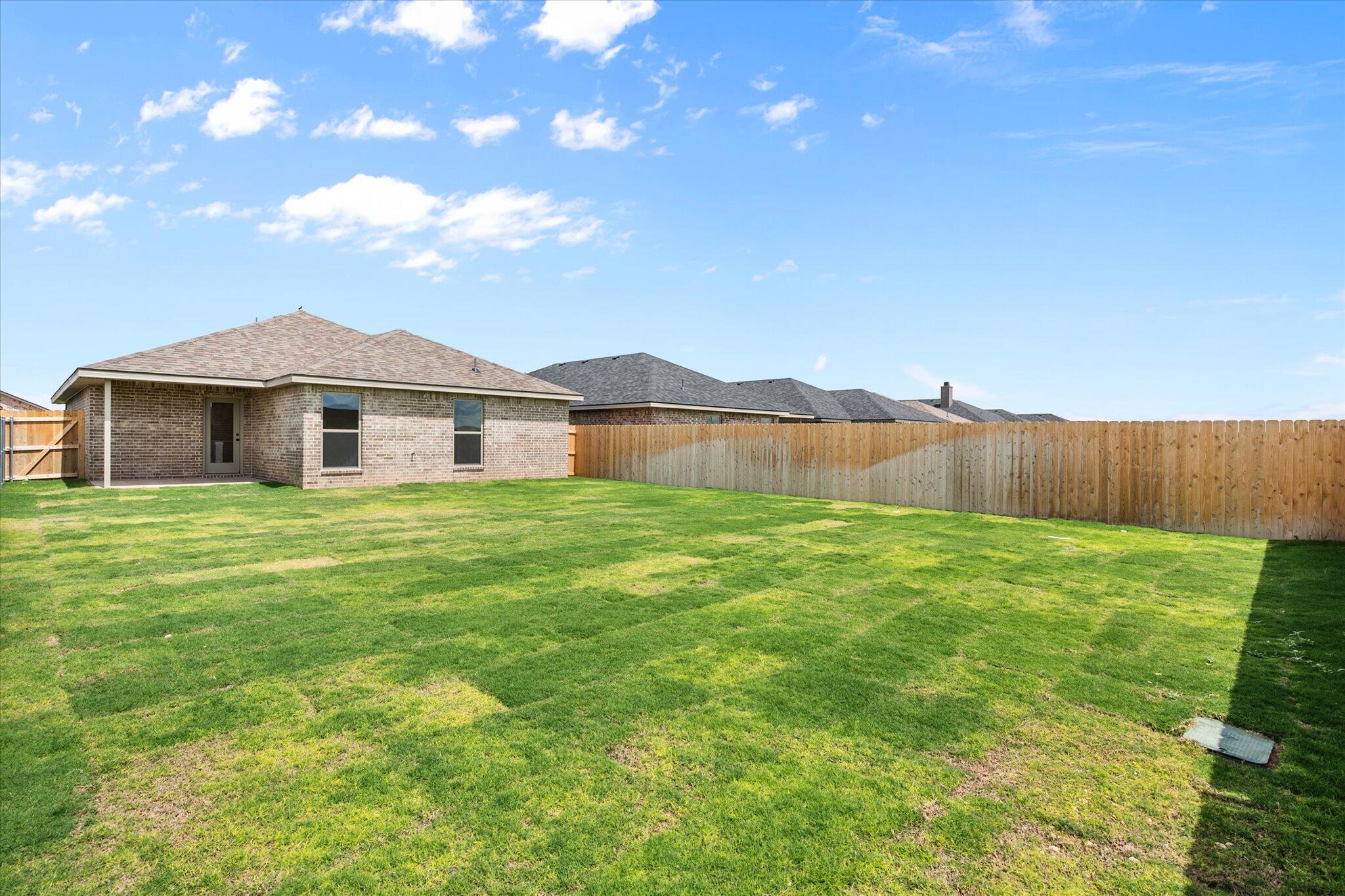 7215 8th Street Lubbock, TX 79416 - Photo 21 of 21 a view of a house with a yard