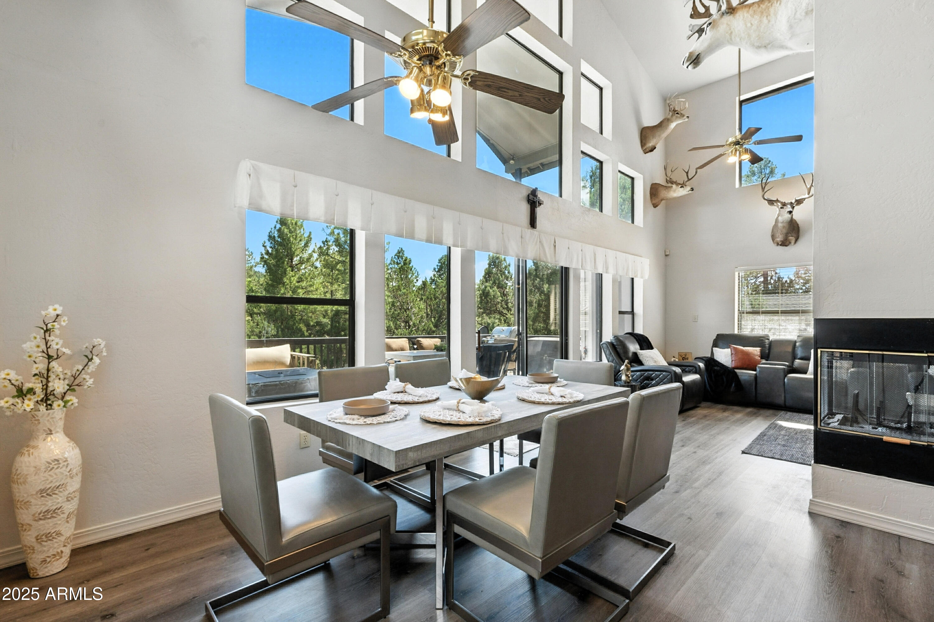 199 South Greystone Circle Payson, AZ 85541 - Photo 15 of 83 a view of a dining room with furniture a chandelier and wooden floor