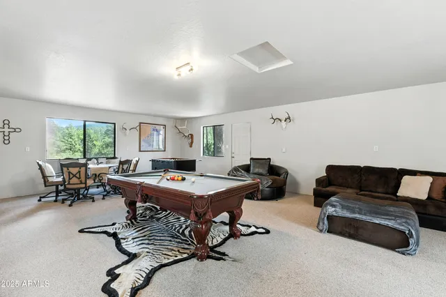 a kitchen with a stove a refrigerator and a stove top oven