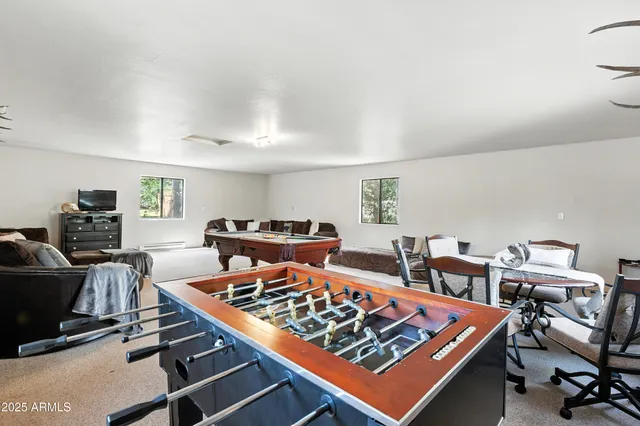 a spacious bedroom with a bed and a fireplace