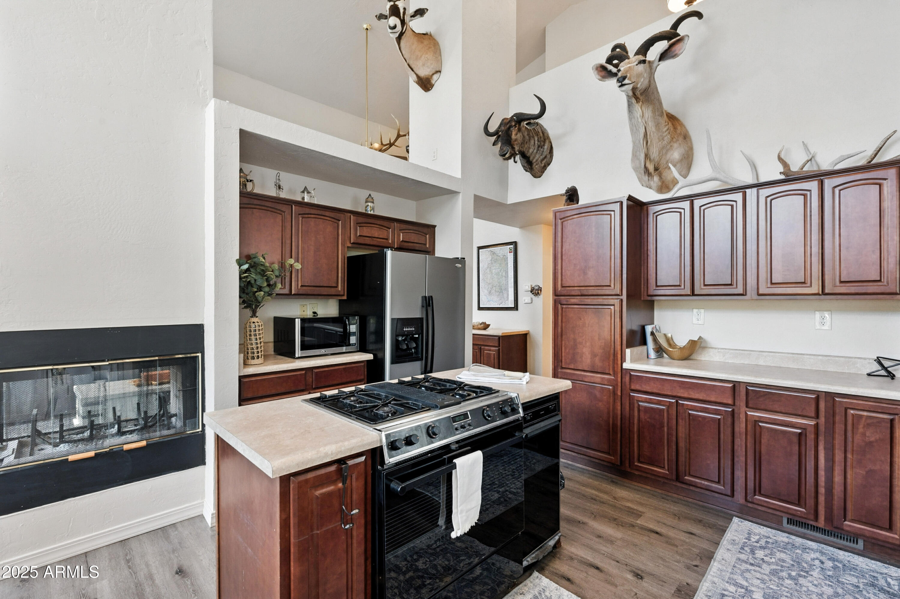 199 South Greystone Circle Payson, AZ 85541 - Photo 21 of 83 a kitchen with stainless steel appliances granite countertop a stove a sink dishwasher and a refrigerator with wooden cabinets