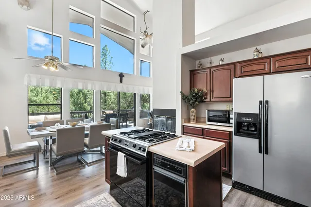 a view of a bedroom with a bed and wooden floor