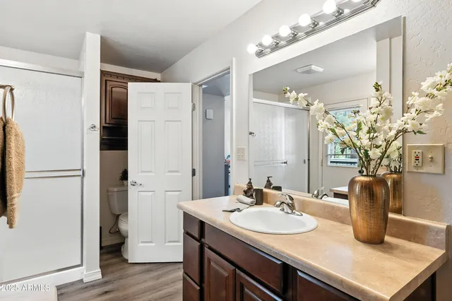 a bedroom with two beds and painted walls
