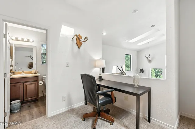a view of a garage with a bike and wooden roof
