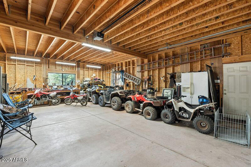 199 South Greystone Circle Payson, AZ 85541 - Photo 49 of 83 a view of a garage with a bike and wooden roof