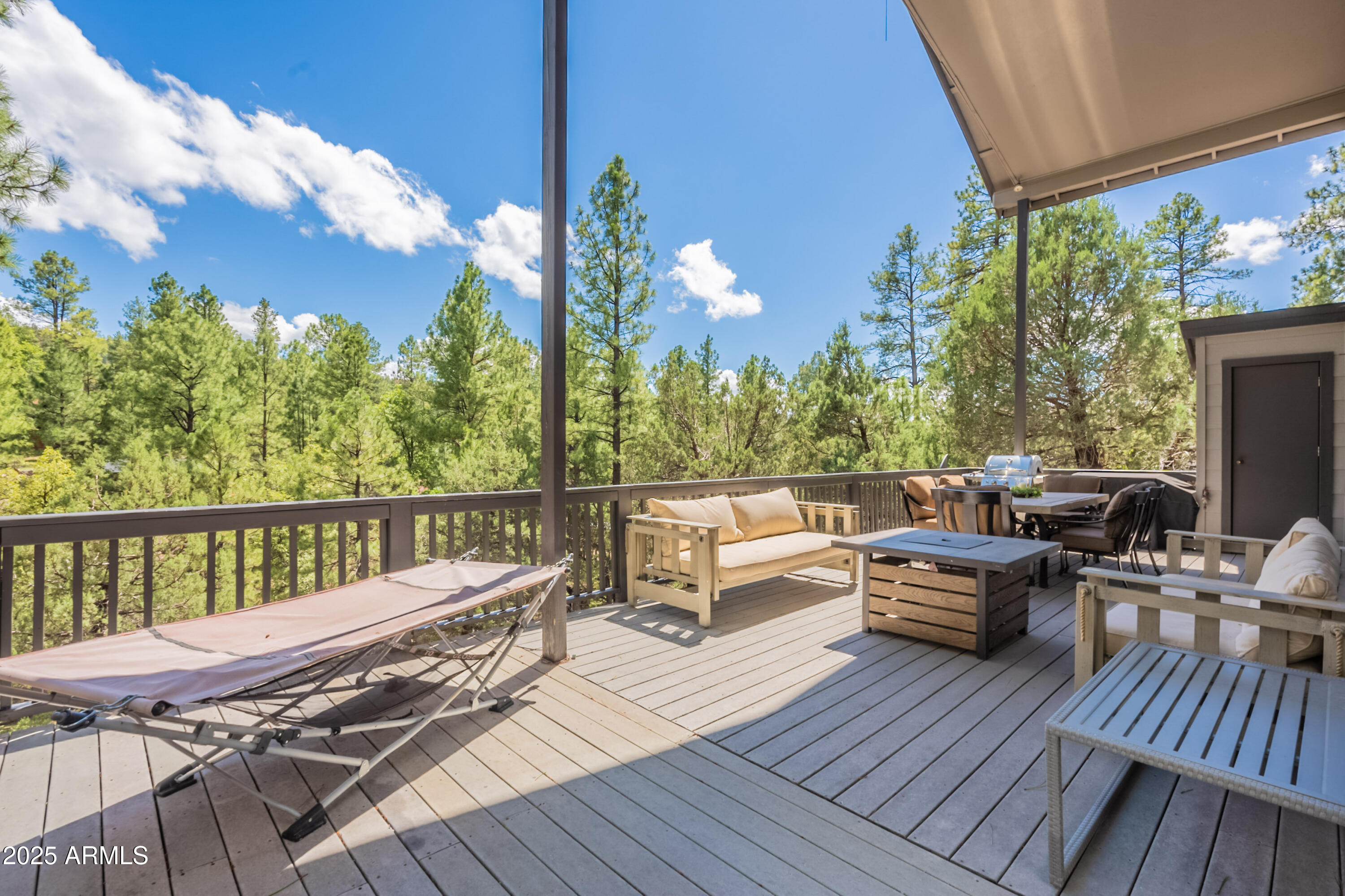 199 South Greystone Circle Payson, AZ 85541 - Photo 54 of 83 a balcony with wooden floor table and chairs