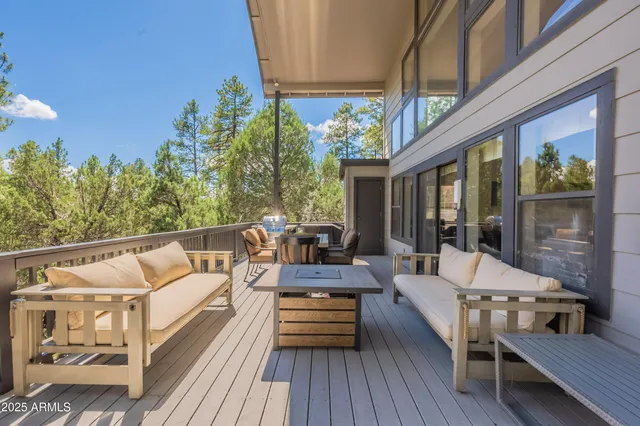 a living room with furniture rug and window