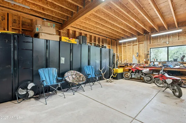 a living room with fireplace furniture and a flat screen tv
