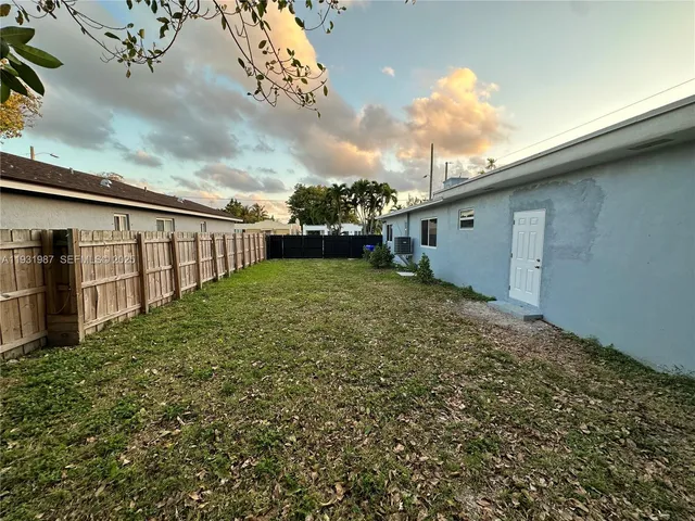 a view of a backyard of the house