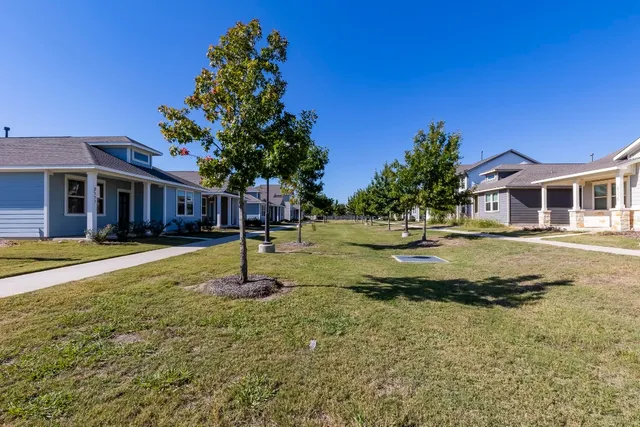 a house with swimming pool in front of it