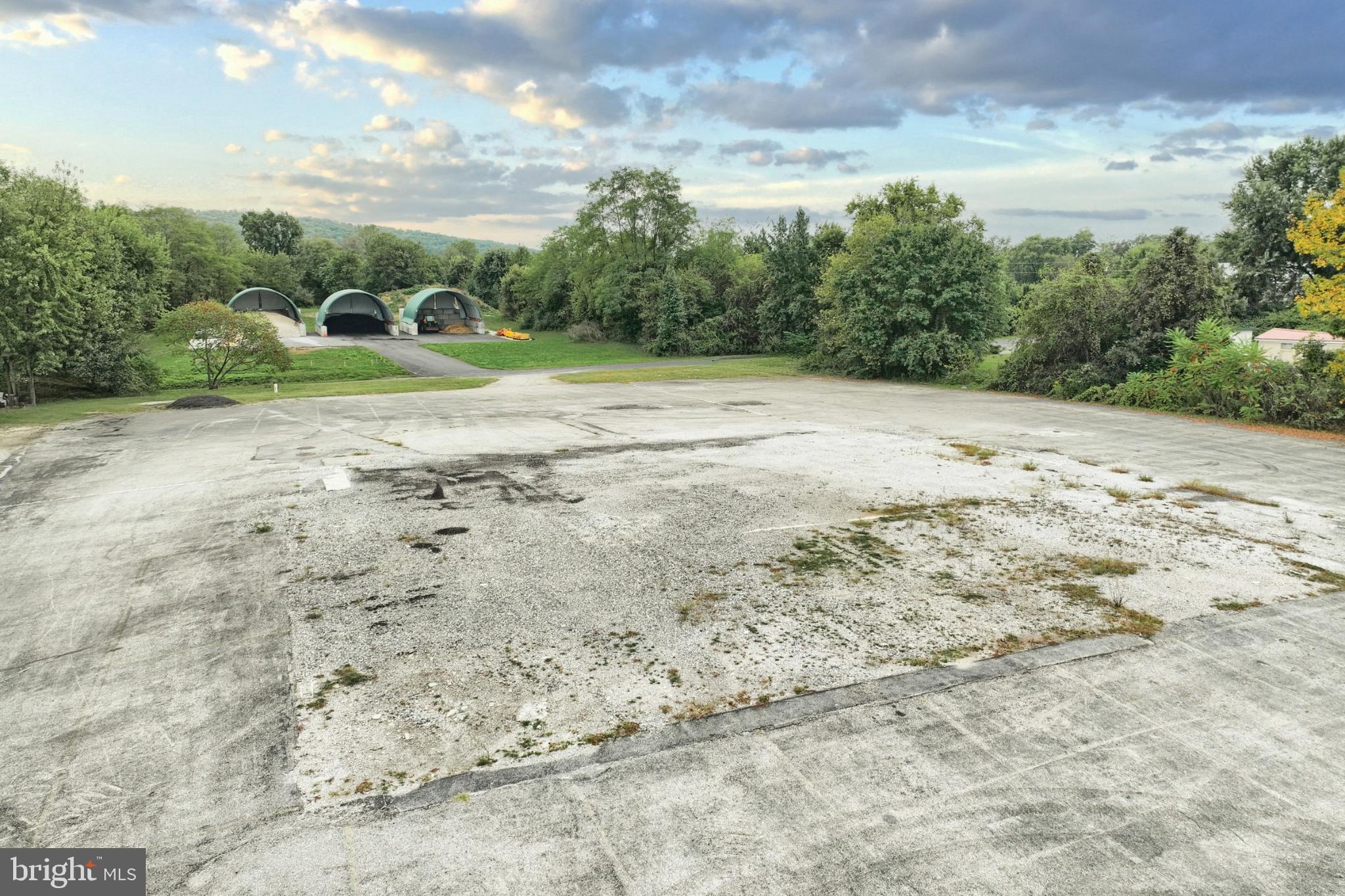 6431 York Road New Oxford, PA 17350 - Photo 11 of 13 a view of a dirt field with trees in the background