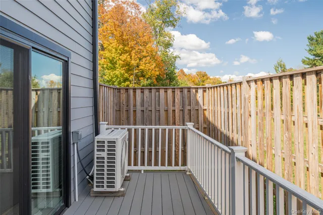 a view of balcony with wooden floor