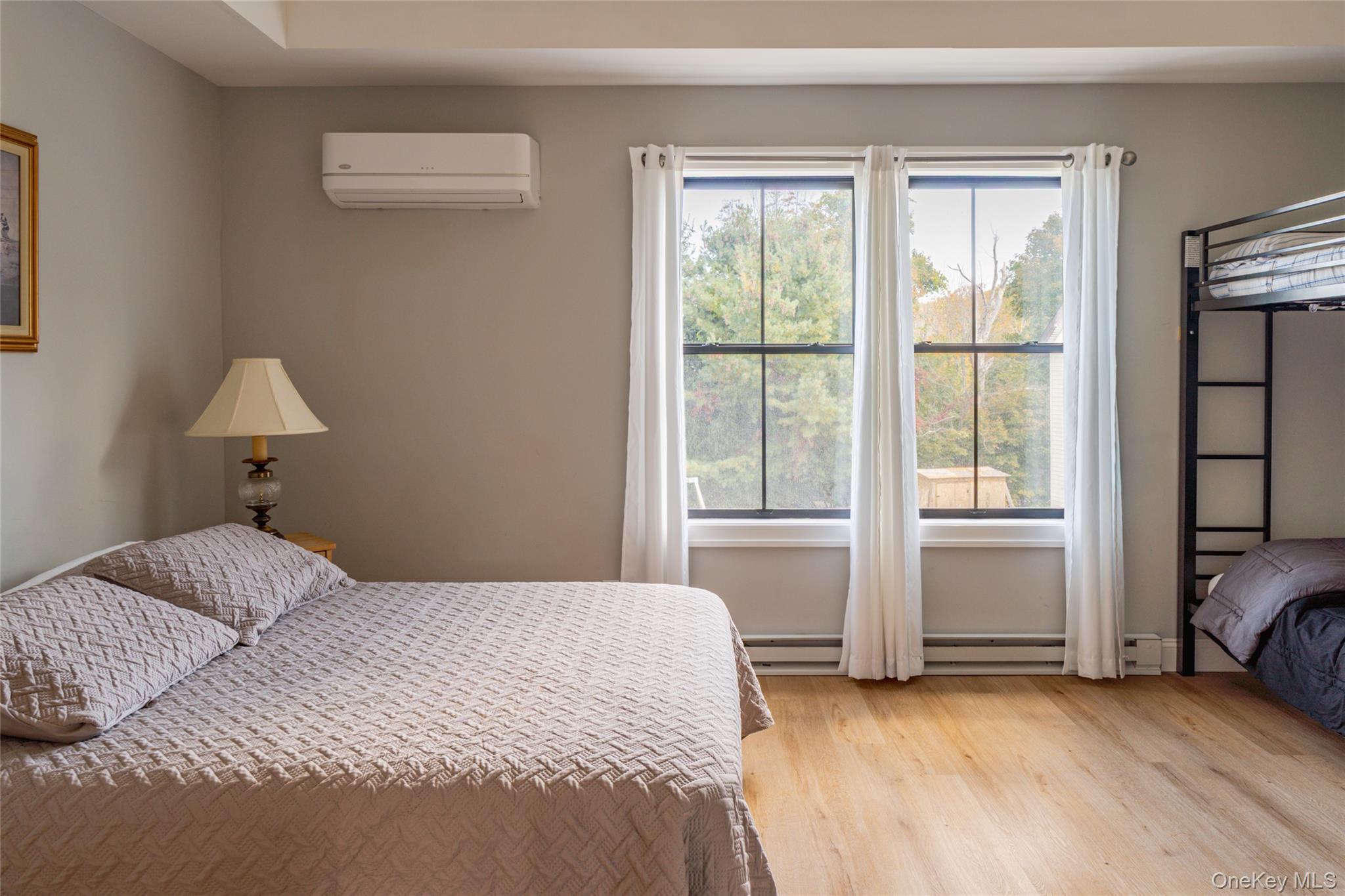 71 County Road 65, Unit 6 Windham, NY 12439 - Photo 19 of 38 a bedroom with a bed and a window