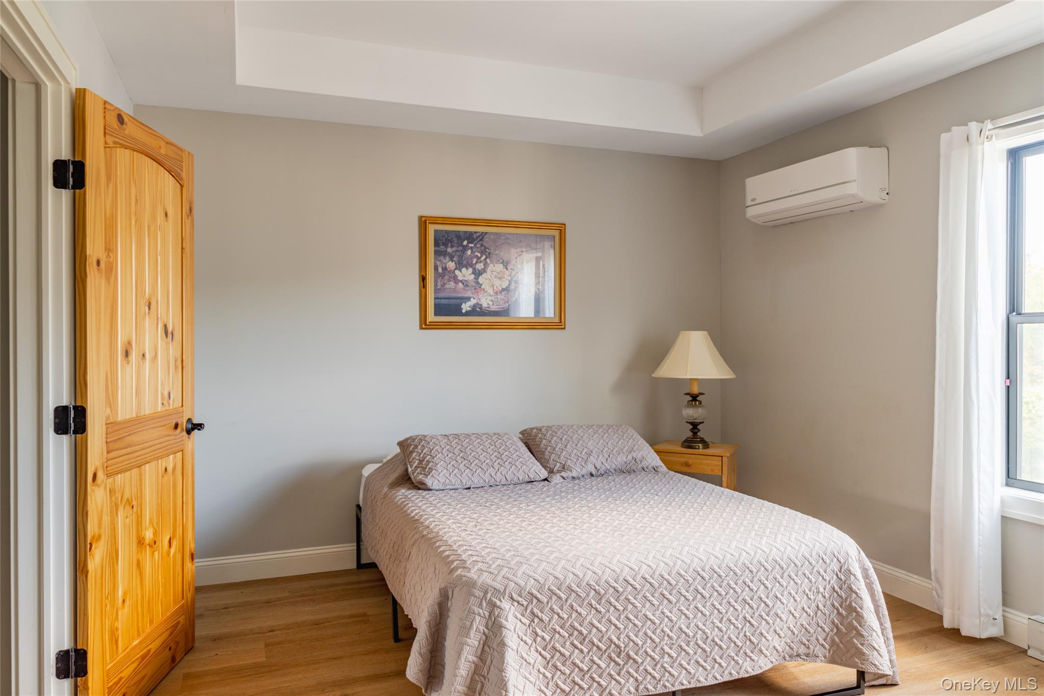 71 County Road 65, Unit 6 Windham, NY 12439 - Photo 21 of 38 a bedroom with a bed and a window