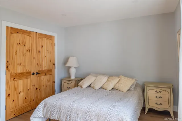 a bedroom with a bed and a tv