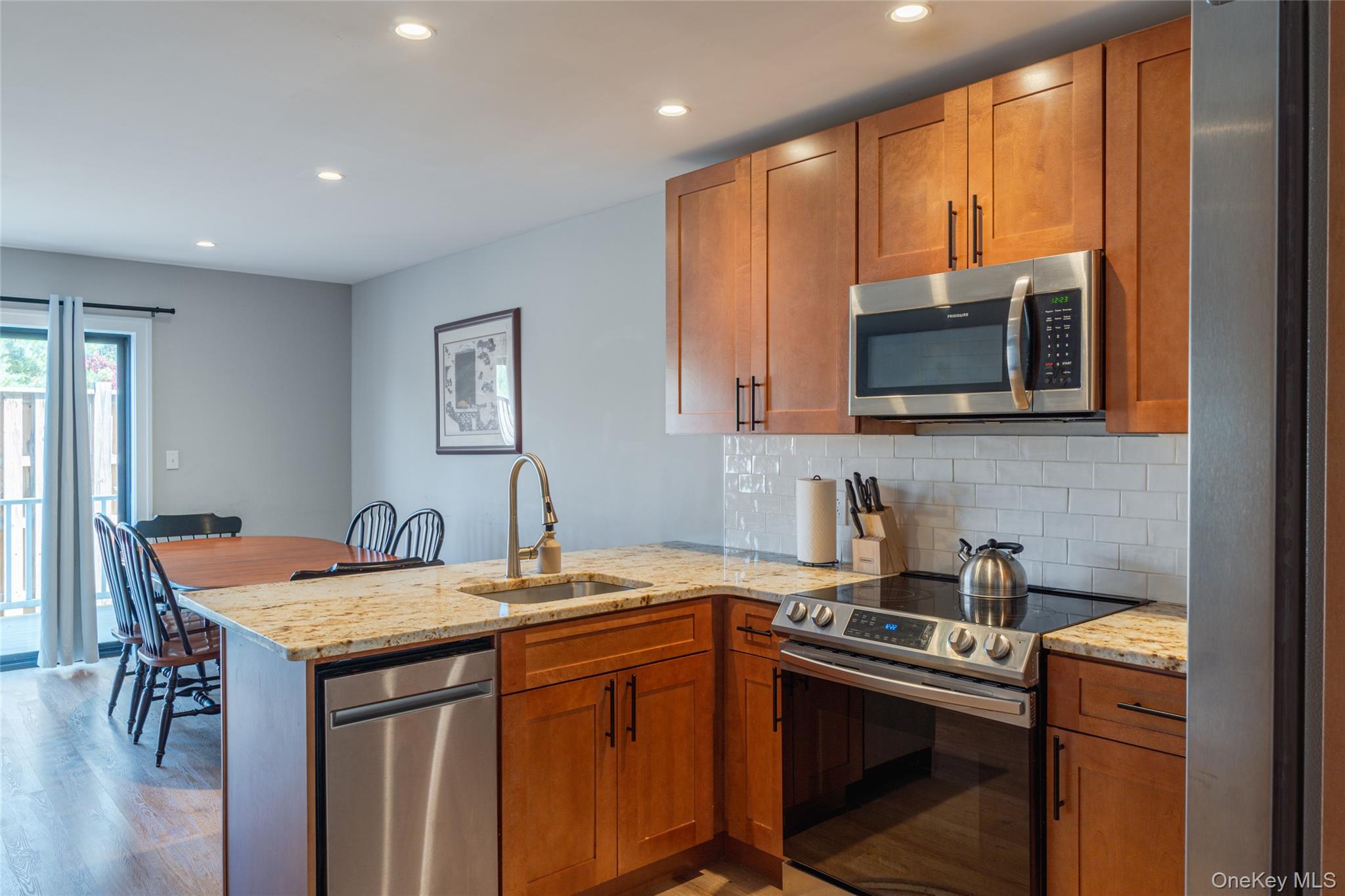71 County Road 65, Unit 6 Windham, NY 12439 - Photo 3 of 38 a kitchen with stainless steel appliances a sink stove and microwave