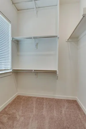 a bathroom with a granite countertop sink a mirror and a shower