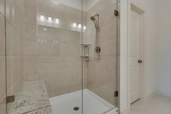 a bathroom with double sink and a mirror