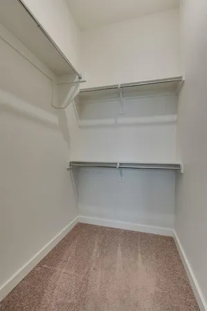 a bathroom with a granite countertop toilet a sink and a bathtub