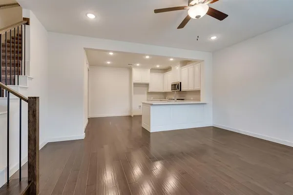 a view of a kitchen with a stove cabinets and wooden floor