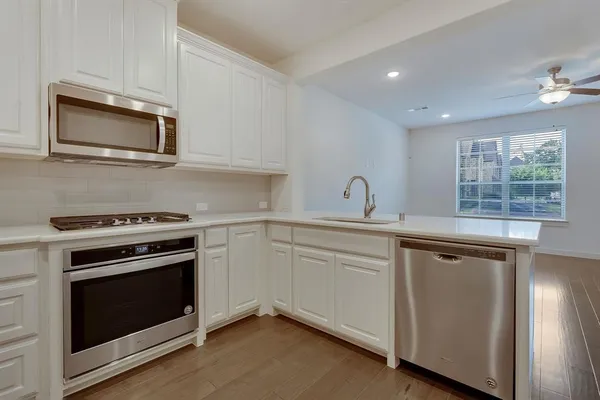 a kitchen with a stove and a microwave