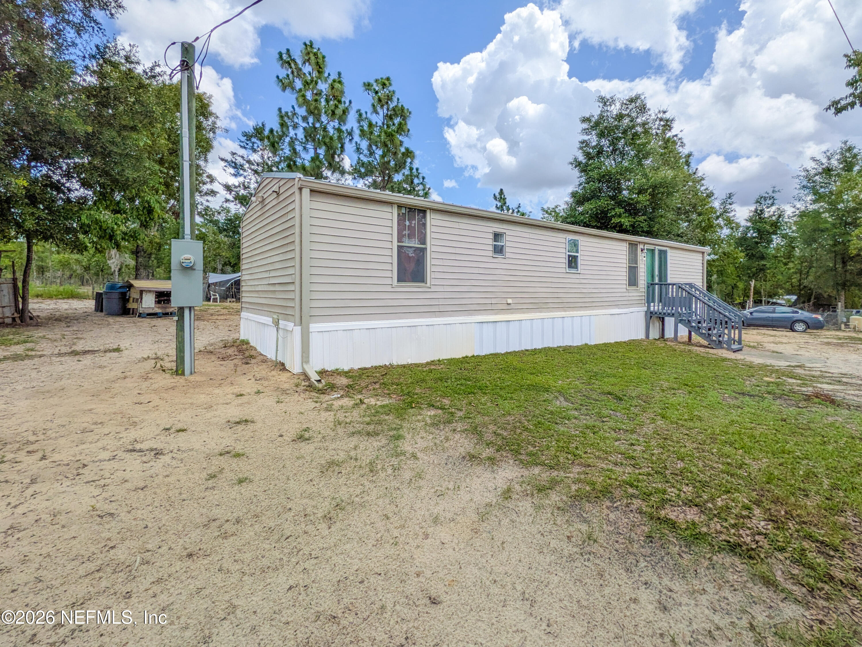 116 London Avenue Interlachen, FL 32148 - Photo 4 of 25 a view of a backyard
