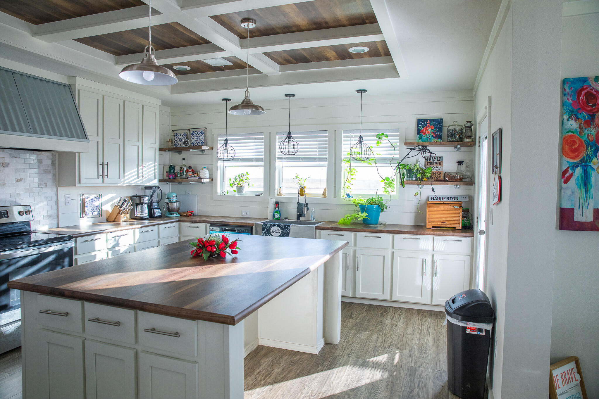 1388 Mallard Road Wilson, TX 79381 - Photo 2 of 45 a kitchen with stainless steel appliances granite countertop a sink a stove and a wooden floors