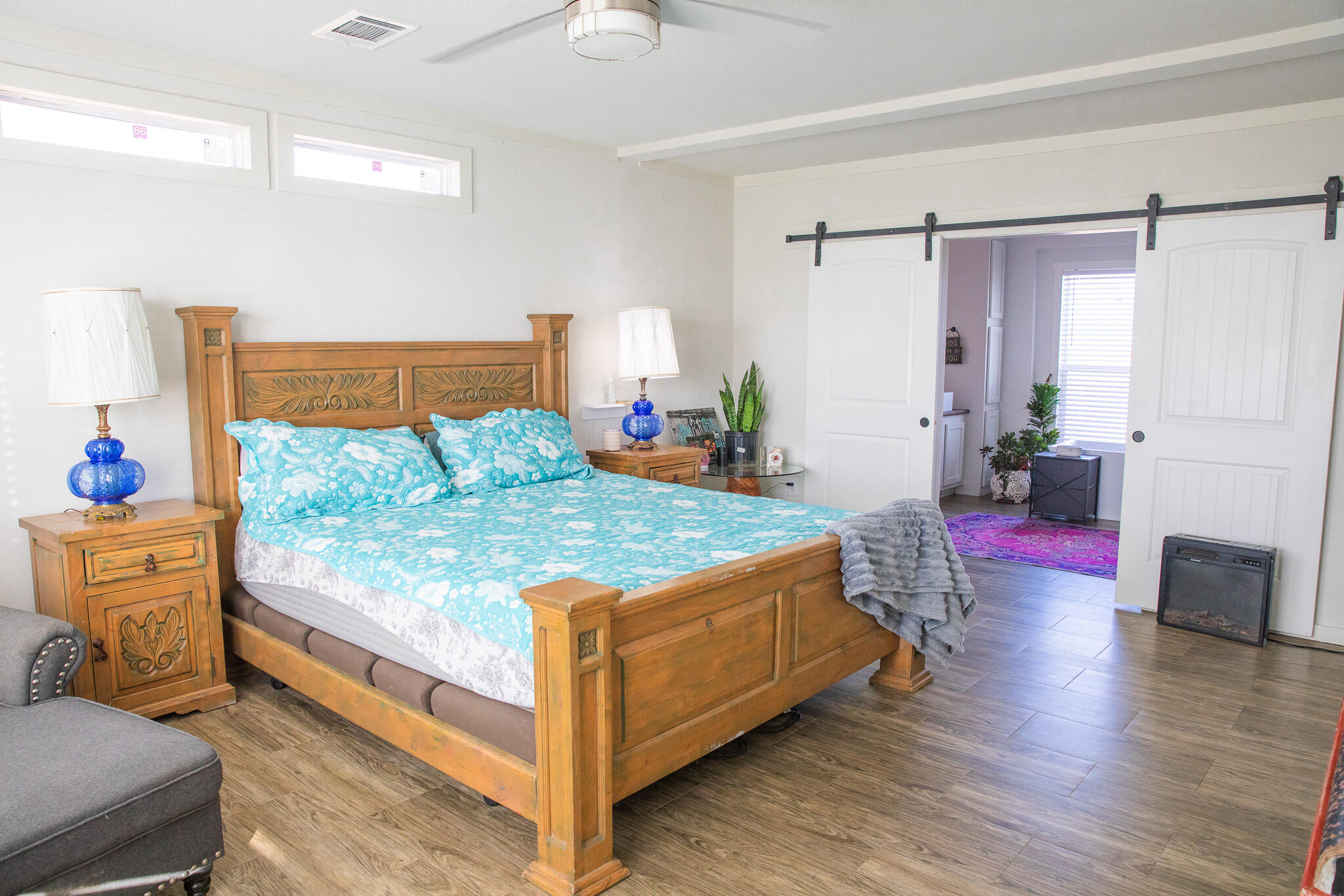 1388 Mallard Road Wilson, TX 79381 - Photo 26 of 45 a bedroom with a bed and wooden floor