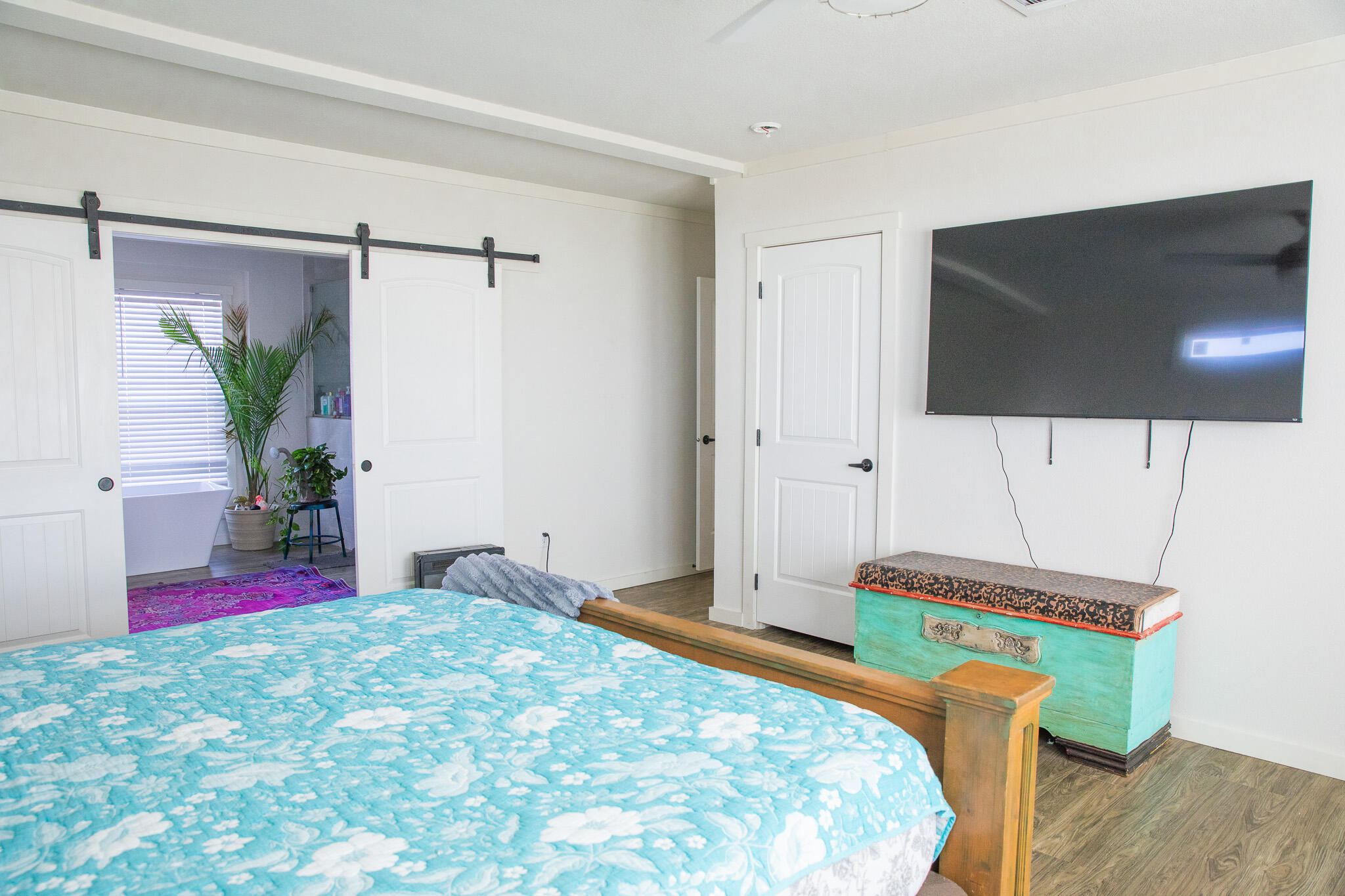 1388 Mallard Road Wilson, TX 79381 - Photo 27 of 45 a bedroom with a bed and a flat screen tv