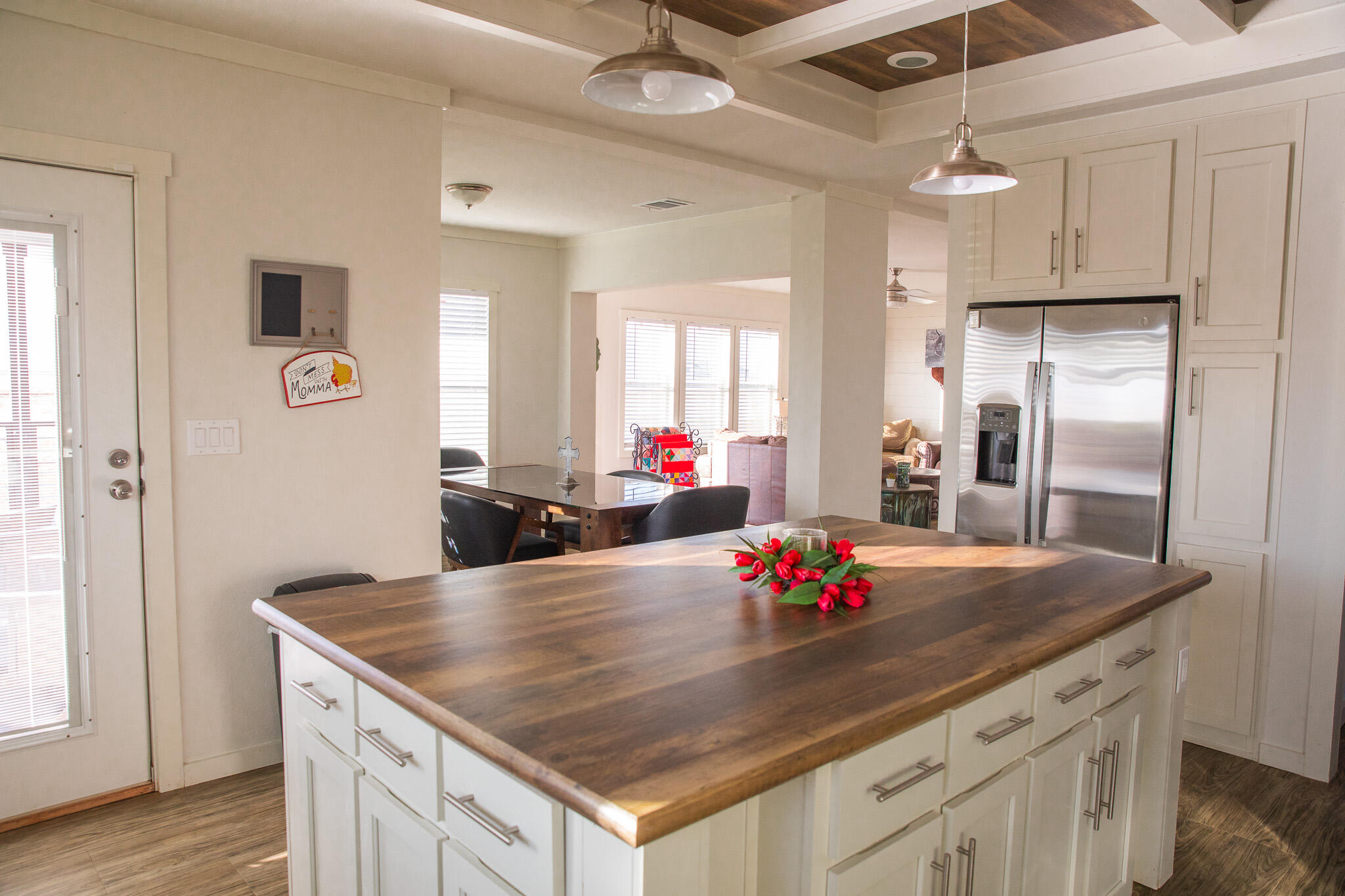 1388 Mallard Road Wilson, TX 79381 - Photo 5 of 45 a kitchen with kitchen island a sink appliances and wooden floor