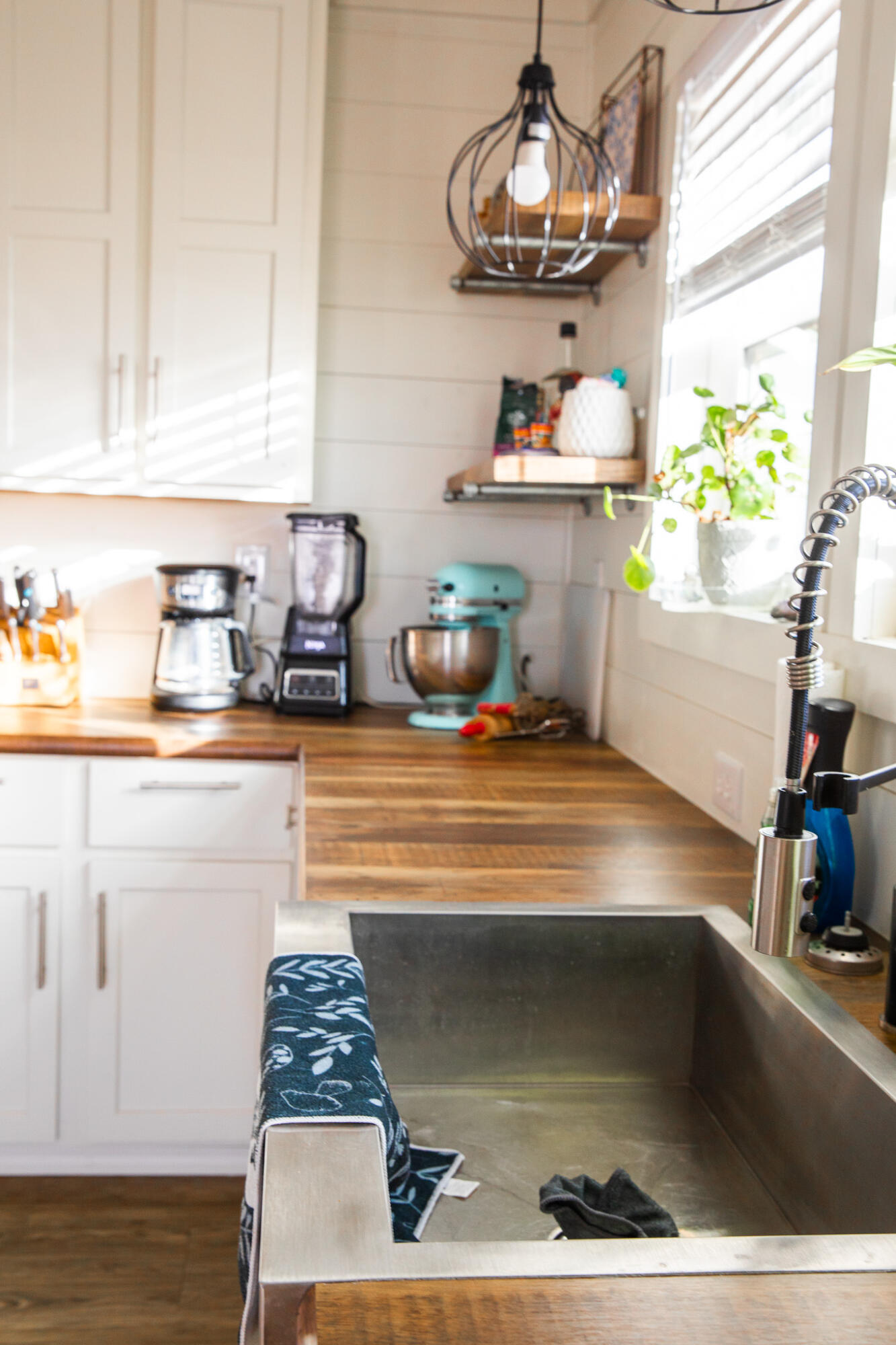 1388 Mallard Road Wilson, TX 79381 - Photo 7 of 45 a kitchen with a sink and chandelier
