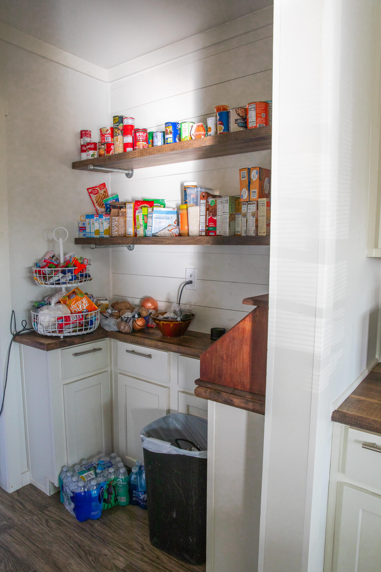 1388 Mallard Road Wilson, TX 79381 - Photo 9 of 45 a kitchen with a refrigerator and a shelf